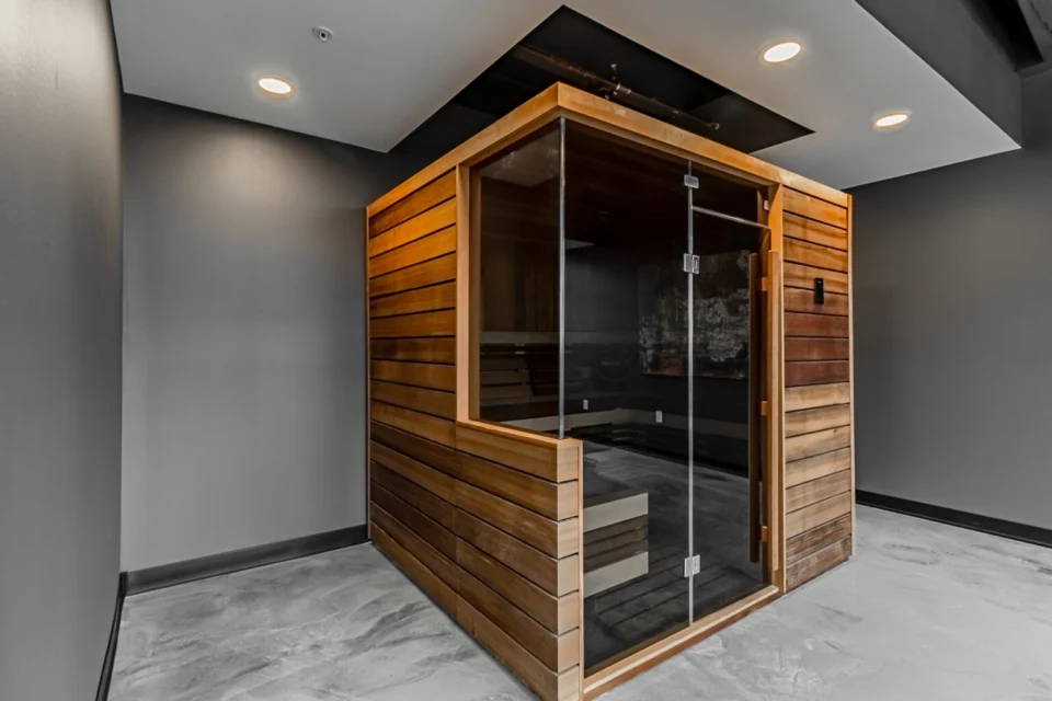 Cedar sauna in a spa suite finished with seamless FlowStone flooring