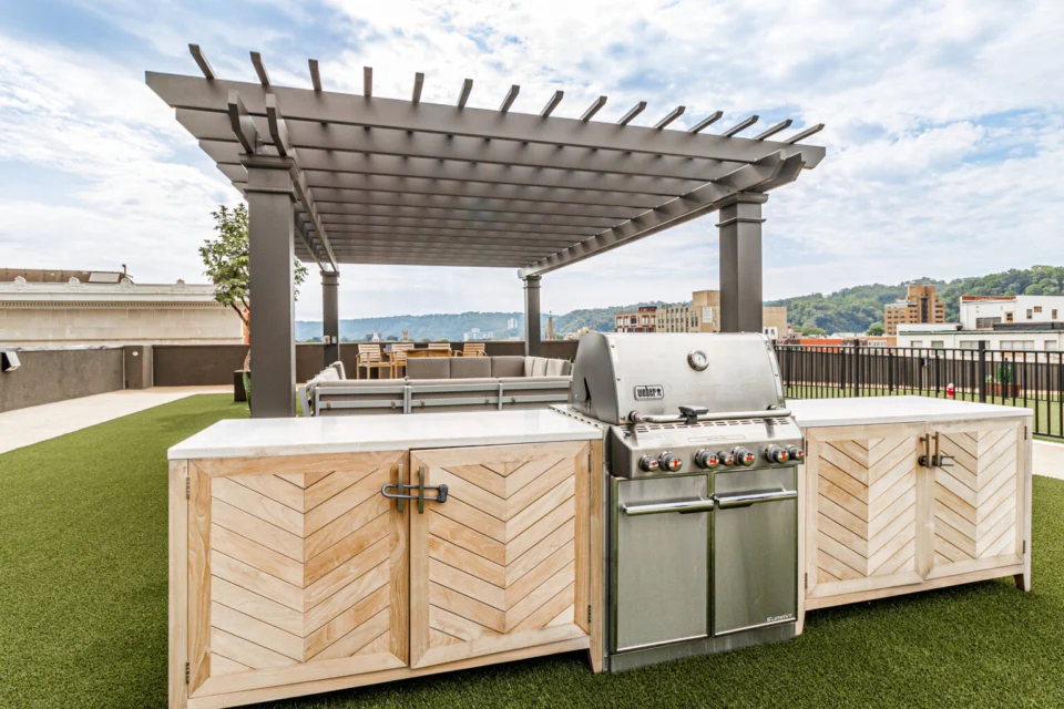 Entertaining kitchen with pergola seating at a luxury residence