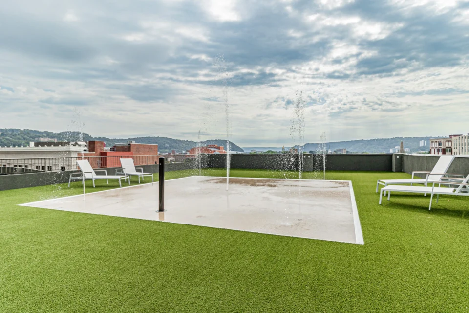 Splash pad and turf lawn at a community amenity space