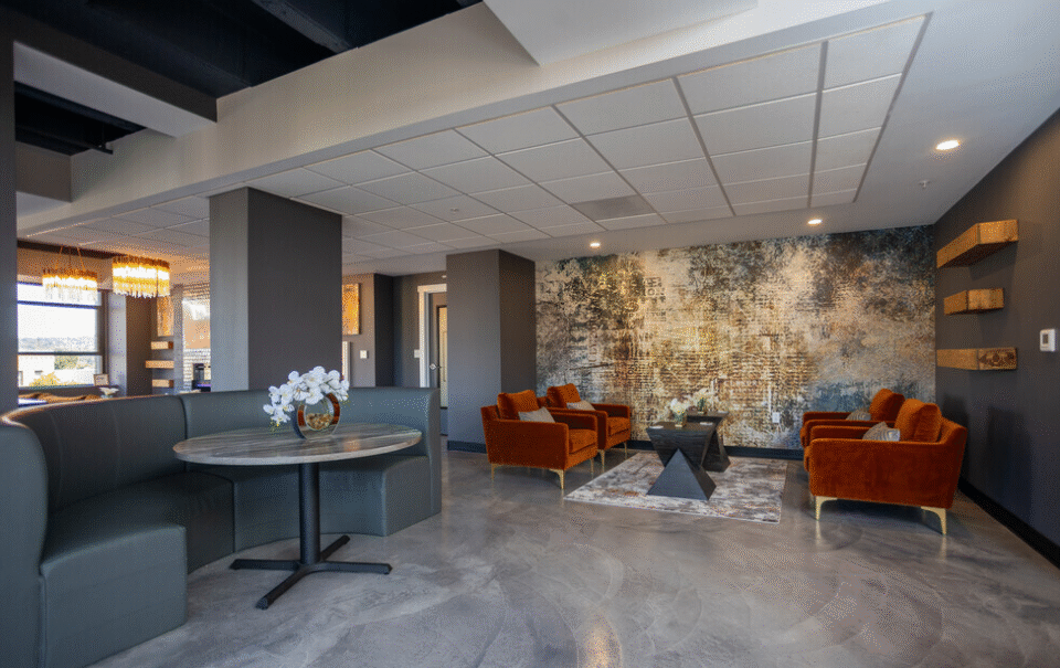 Resident lounge with stone feature wall and FlowStone floor
